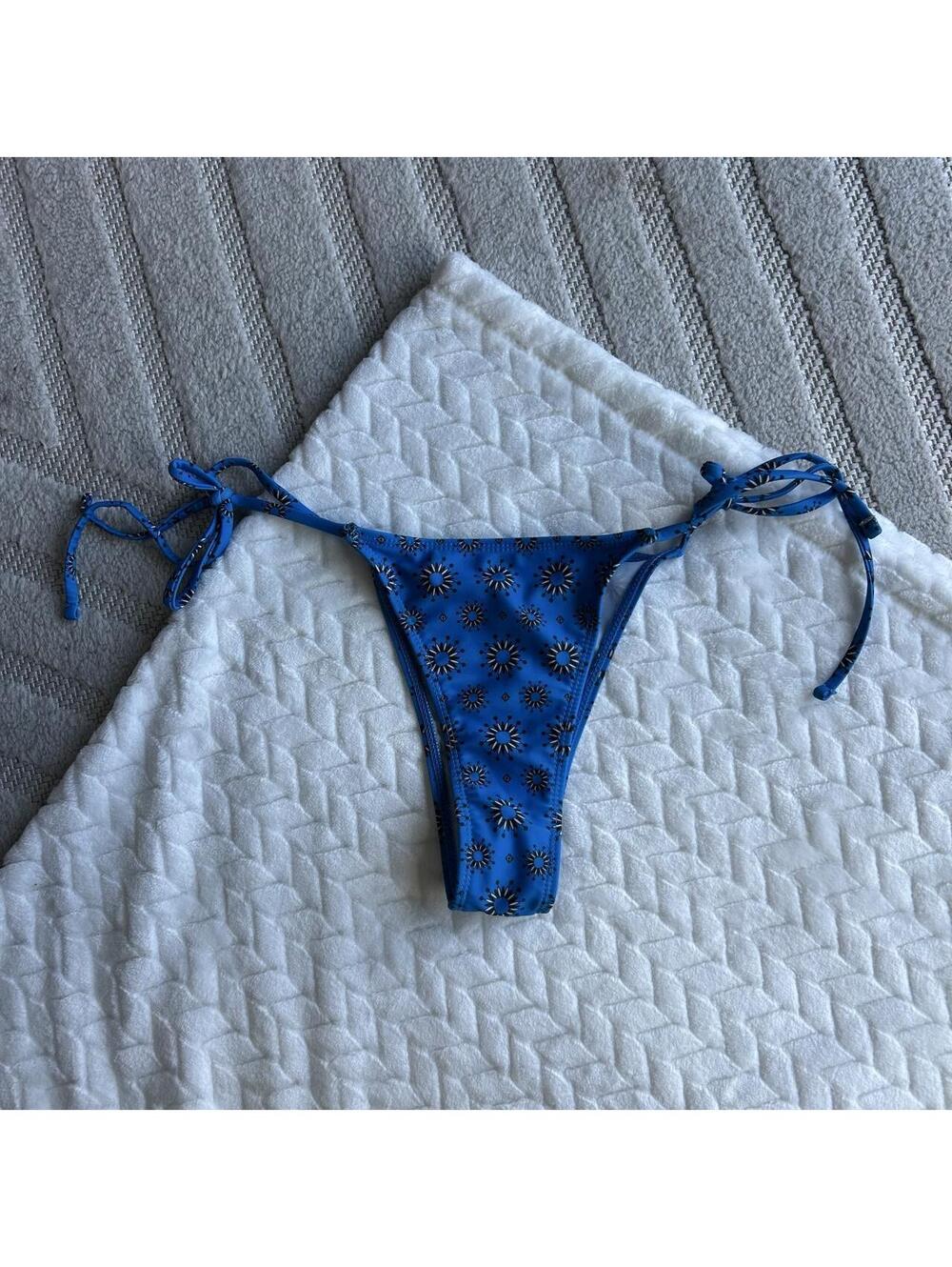 Blue bikini bottoms with black starburst pattern #swimwear #beachwear